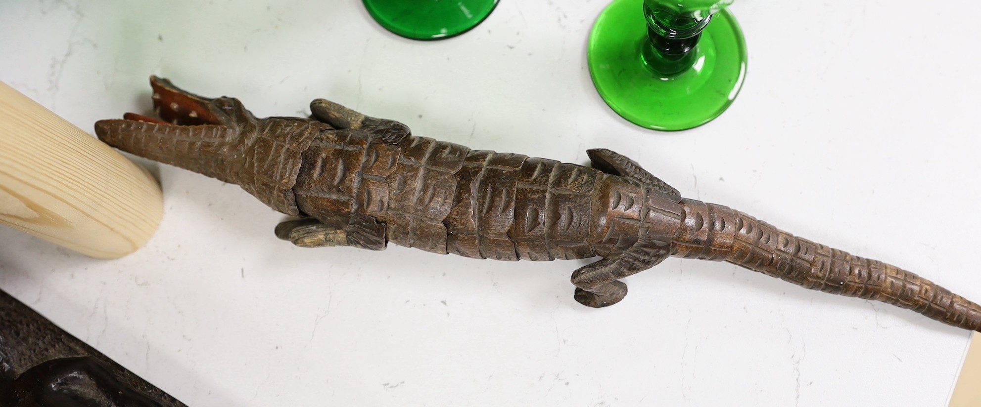 An interesting sectional wooden articulated crocodile, together with African wooden tribal carved totems, and other miscellaneous wooden items, tallest 53cm
